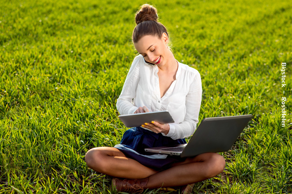 Young Woman, Girl Working With Laptop, Tablet And Phone In Green